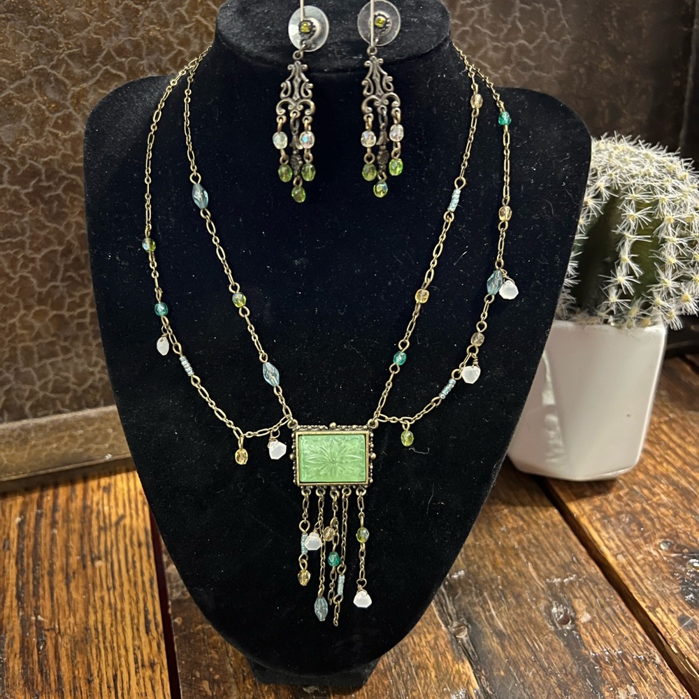 Lovely gold-tone double strand necklace with coordinating earrings